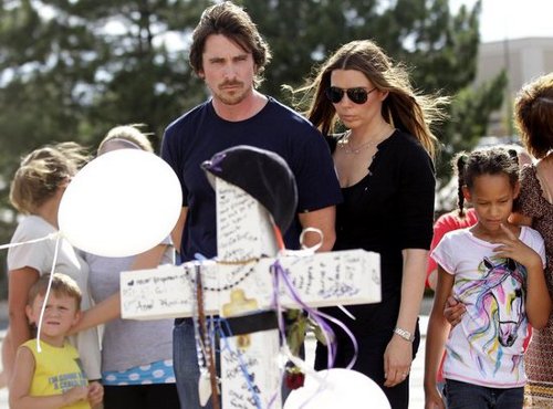 Christian Bale and his wife visit the memorial in Aurora, Colorado.